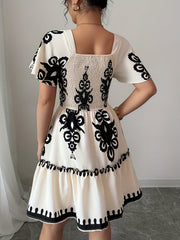 Elegant Mini Dress with a Square Neckline, Featuring Fashionable Prints, Pleats, a Cinched Waist for a Slimming Effect, And Ruffled Edges with an A-Line Hem.
