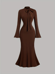 Elegant Long-Sleeve Mermaid Dress with a High Collar And Bow Tie, Fitted for Gatherings And Accentuating Curves.