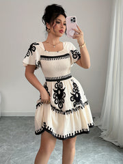 Elegant Mini Dress with a Square Neckline, Featuring Fashionable Prints, Pleats, a Cinched Waist for a Slimming Effect, And Ruffled Edges with an A-Line Hem.